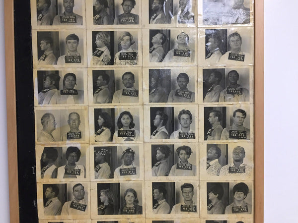 A collection of actual Houston Texas mugshots glued to board and framed