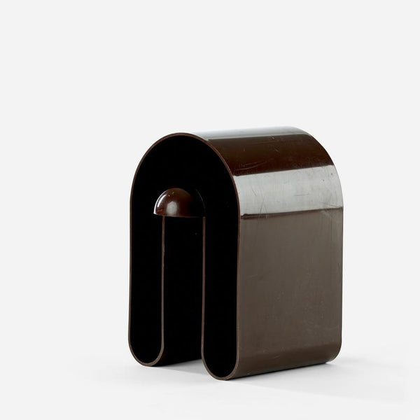 Brown plastic magazine holder designed by Rodolfo Bonetto