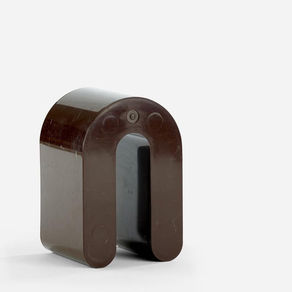 Brown plastic magazine holder designed by Rodolfo Bonetto