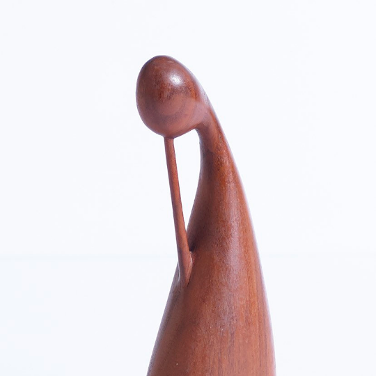Hand carved walnut sculpture in the form of a female figure