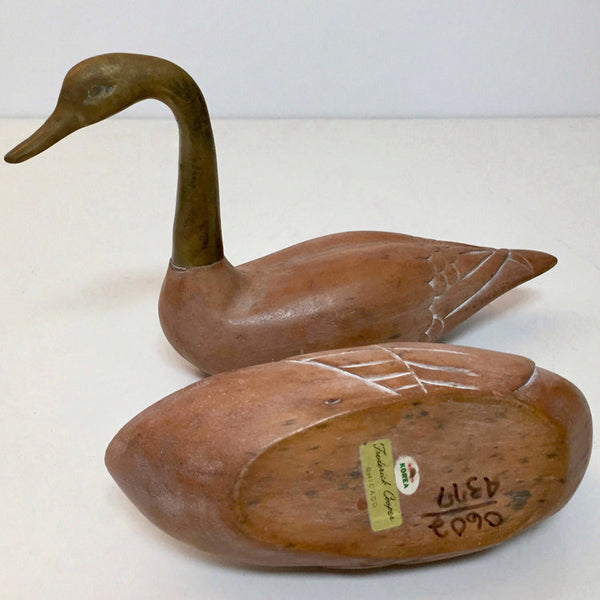 Pair of wood and brass decorative swans by Frederick Cooper