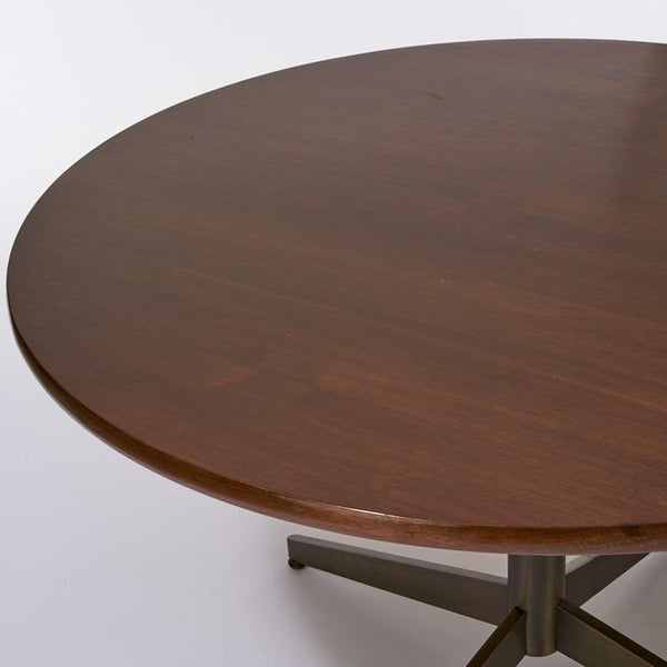 Round walnut dining table with bronze base