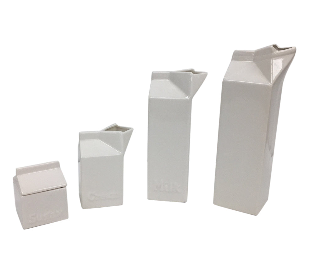 Set of four white ceramic pop art design collectibles