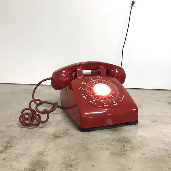 Vintage, giant-sized, candy red, plastic Western electric telephone with light-up rotary dial
