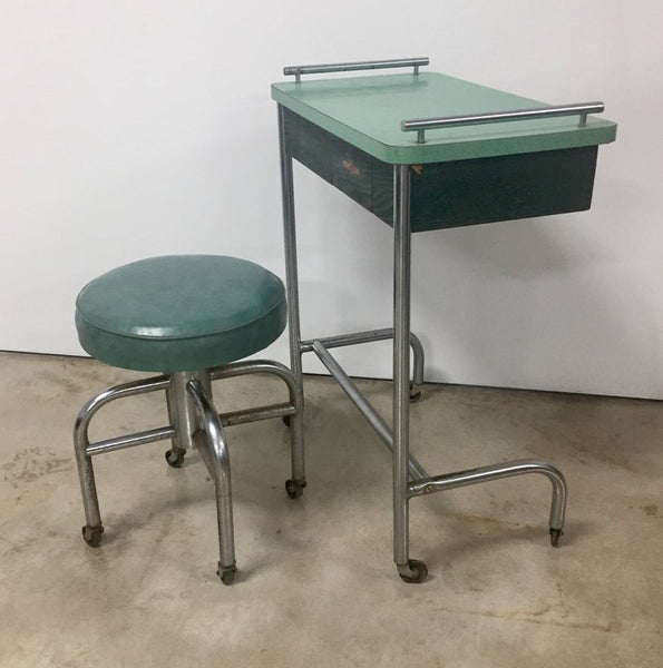 Vintage industrial tubular steel rolling stool and cantilevered table