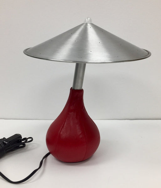 Pablo Pardo Piccola table lamp with spun aluminum shade and red leather bean bag base