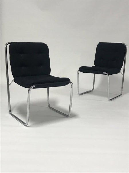 Pair of black upholstered tubular steel Cosco sling chairs