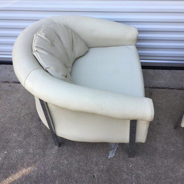 Pair of large white vinyl and chrome lounge chairs